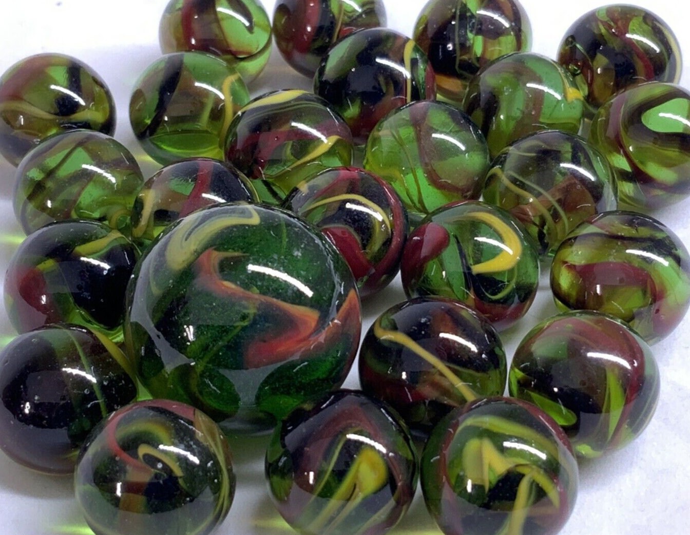25 Marbles T-REX Green Glass Red Yellow Swirl game pack Shooter