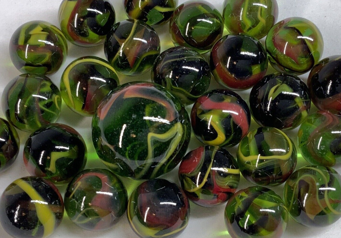 25 Marbles T-REX Green Glass Red Yellow Swirl game pack Shooter