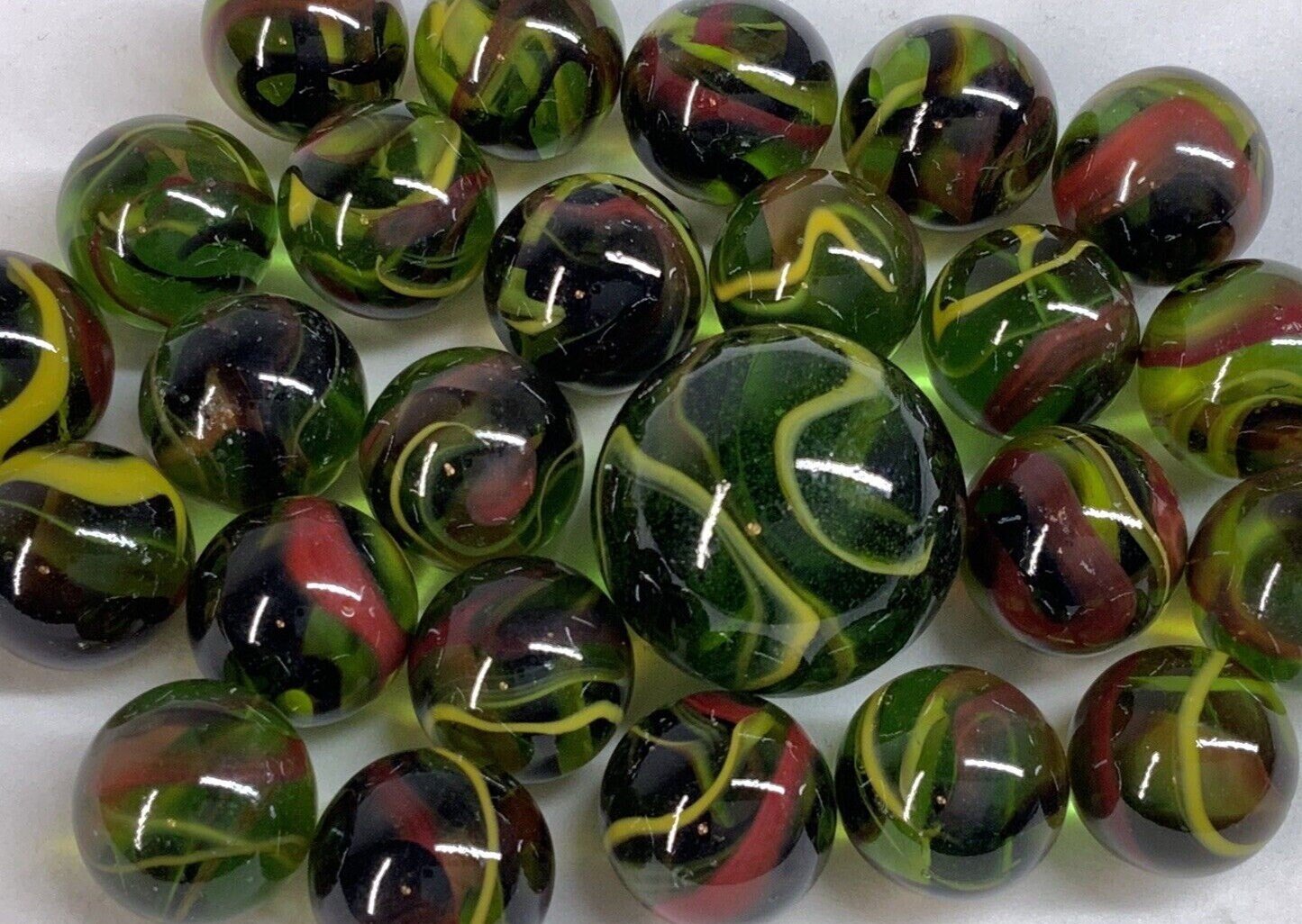 25 Marbles T-REX Green Glass Red Yellow Swirl game pack Shooter